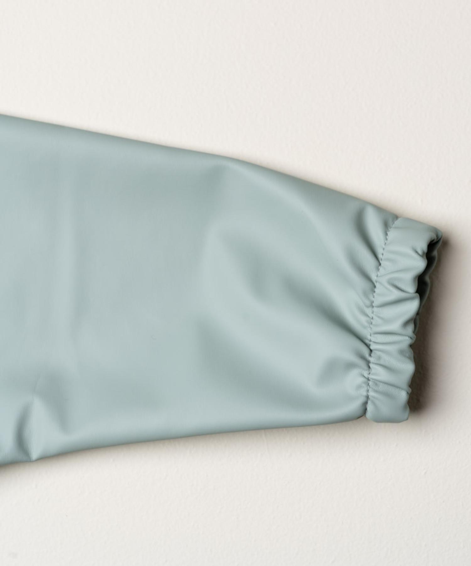 Smekke med ermer og lomme - Green dream Knatteplock